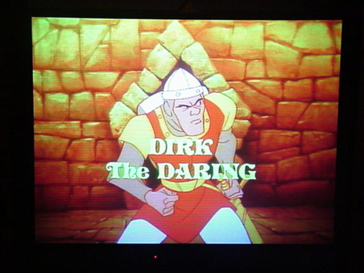 The restored cabinet's screen showing Dragon's Lair running — the hero Dirk the Daring against a castle wall